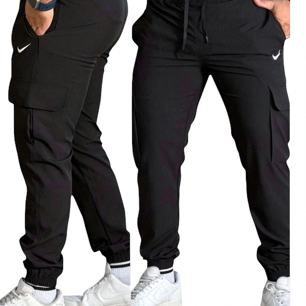 DUALLITY WEAR black cargo pants with white Nike logo, drawstring waist, and multiple pockets. Versatile for urban or gym wear.