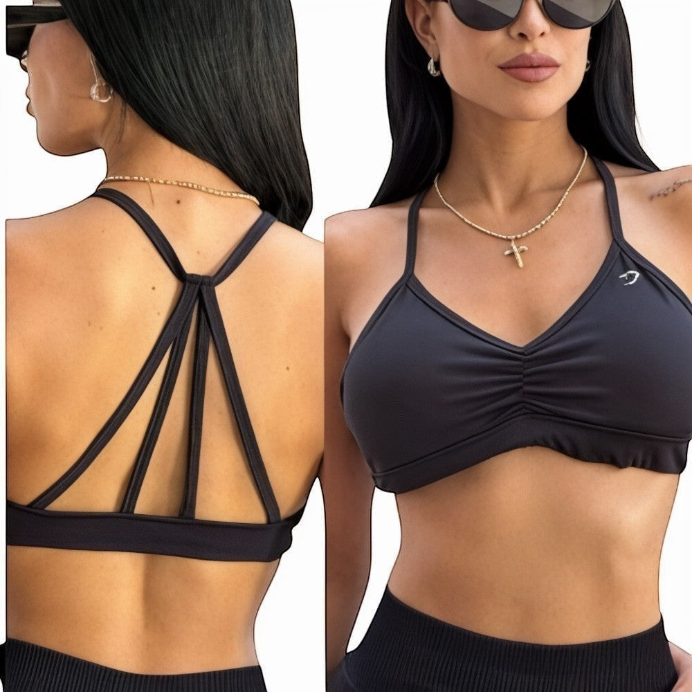 DUALLITY WEAR black ruched sports bra with strappy back detail, made from lightweight stretch fabric for gym or daily wear.