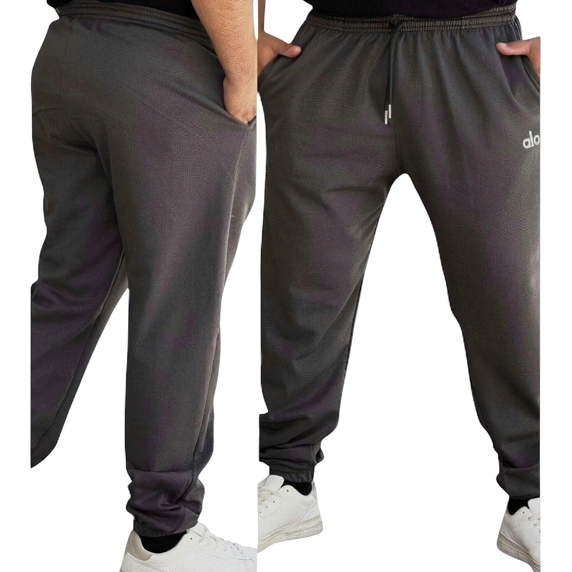 DUALLITY WEAR dark grey jogger pants with drawstring waist and subtle textured fabric. Relaxed fit.