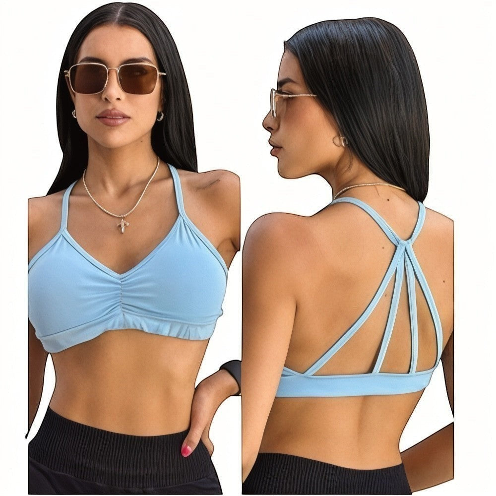 DUALLITY WEAR light blue ruched sports bra with strappy back detail, made of lightweight stretch fabric for gym or daily wear.